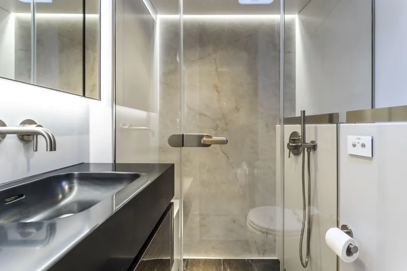 Naoma Yacht Photos Pics Luxurious bathroom in 2022 Sunreef 70 NAOMA yacht, featuring sleek design and modern fixtures.