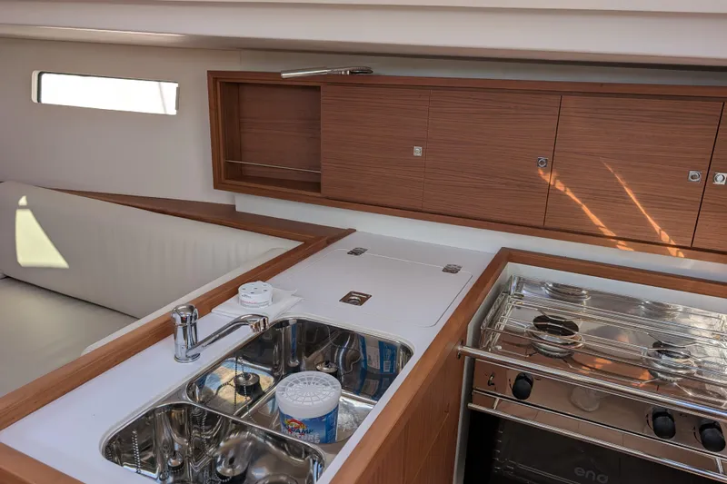 Blue Yonder Yacht Photos Pics 2024 J Boats J/112E yacht interior with modern kitchen and wooden cabinetry.