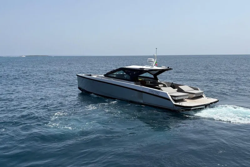  Yacht Photos Pics 2024 Wally Power 50 yacht cruising on open sea, showcasing sleek design and luxury.