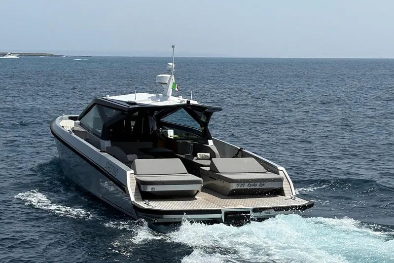  Yacht Photos Pics 2024 Wally Power 50 yacht cruising on open sea, rear view.