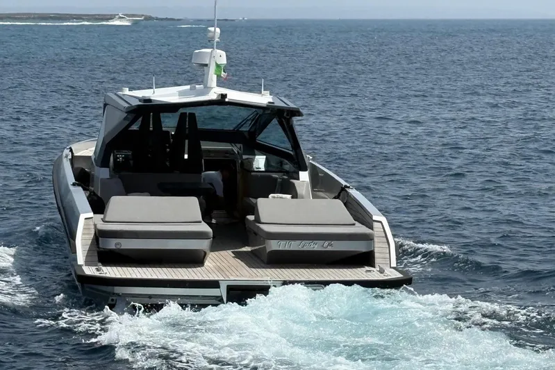  Yacht Photos Pics 2024 Wally Power 50 yacht cruising on open sea, rear view.