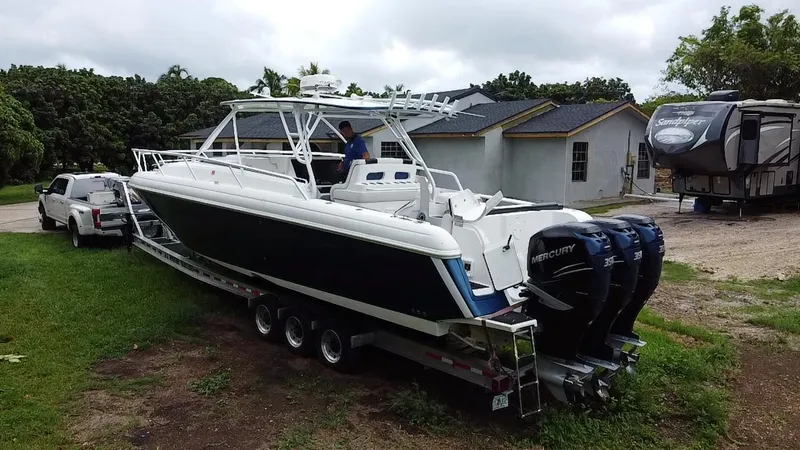  Yacht Photos Pics 2008 Intrepid 390 Sport Yacht on trailer, parked near a house and RV.