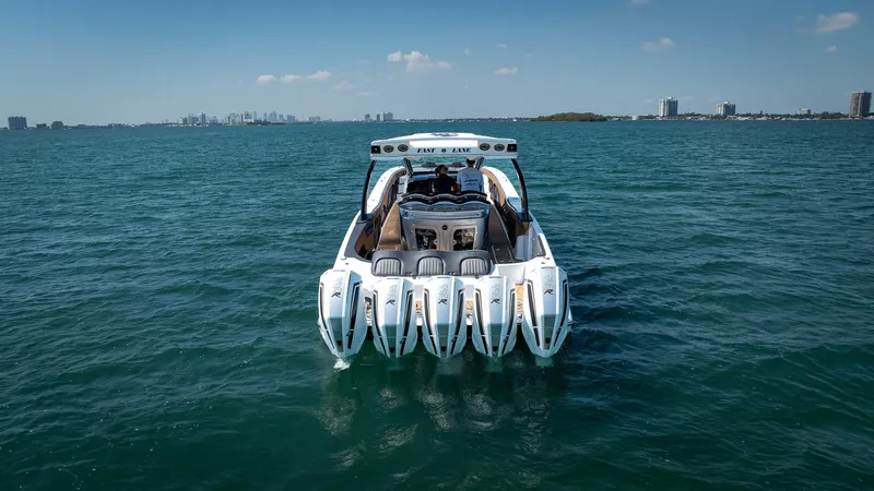  Yacht Photos Pics Luxury MTI V50 boat with five engines cruising on open water, 2022 model.