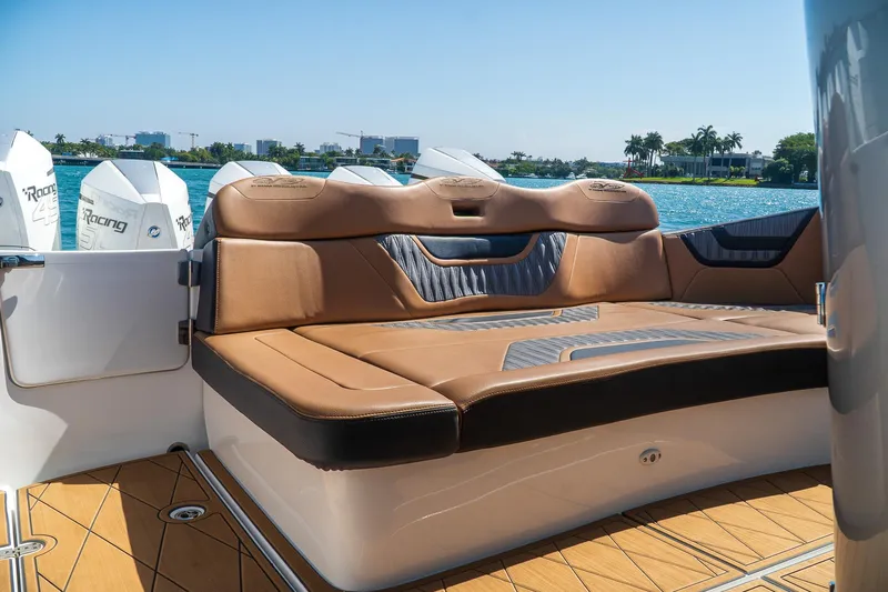  Yacht Photos Pics Luxurious seating on MTI V50 boat, 2022 model, with scenic waterfront view.