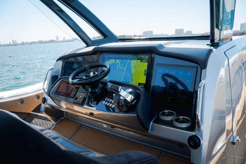  Yacht Photos Pics Helm of 2022 MTI V50 boat with advanced navigation system and steering wheel.