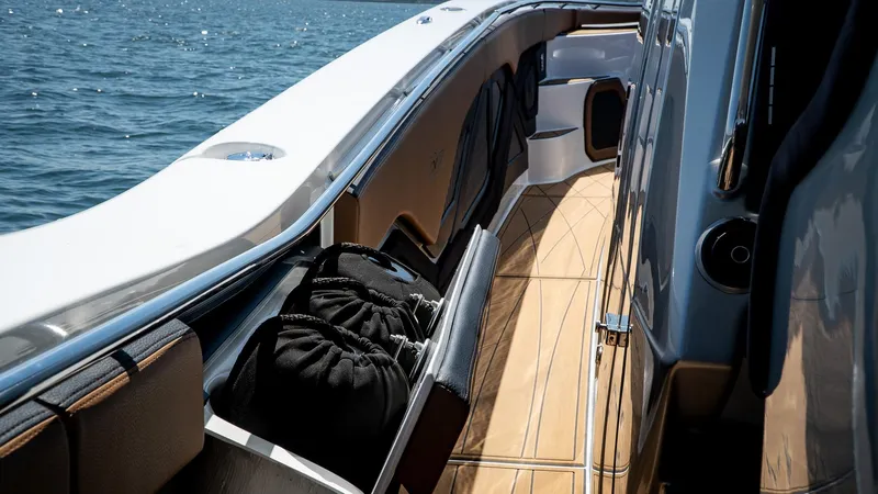  Yacht Photos Pics Luxury MTI V50 yacht deck with sleek design, 2022 model, cruising on open water.