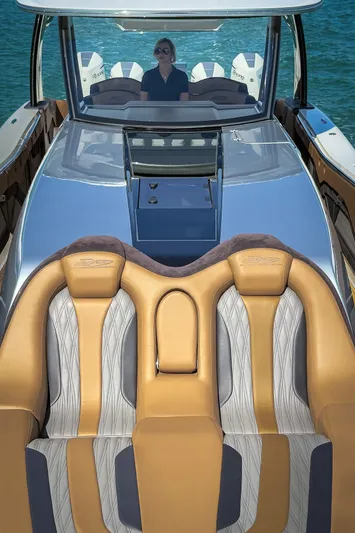  Yacht Photos Pics Luxury MTI V50 boat interior with tan and gray seating, 2022 model on water.