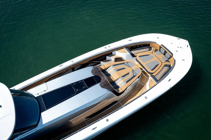  Yacht Photos Pics Luxurious 2022 MTI V50 yacht with sleek design and spacious deck on calm water.