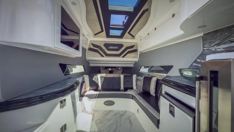  Yacht Photos Pics Luxurious interior of 2022 MTI V50 boat with modern design and skylight.