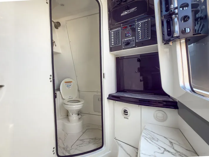  Yacht Photos Pics Interior of 2022 MTI V50 boat featuring a compact bathroom with modern amenities.