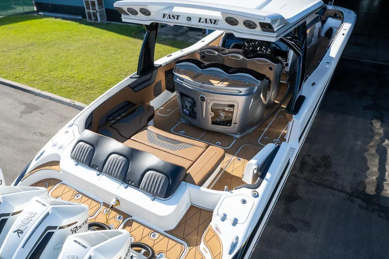  Yacht Photos Pics 2022 MTI V50 boat with luxurious seating and sleek design, labeled "Fast Lane."