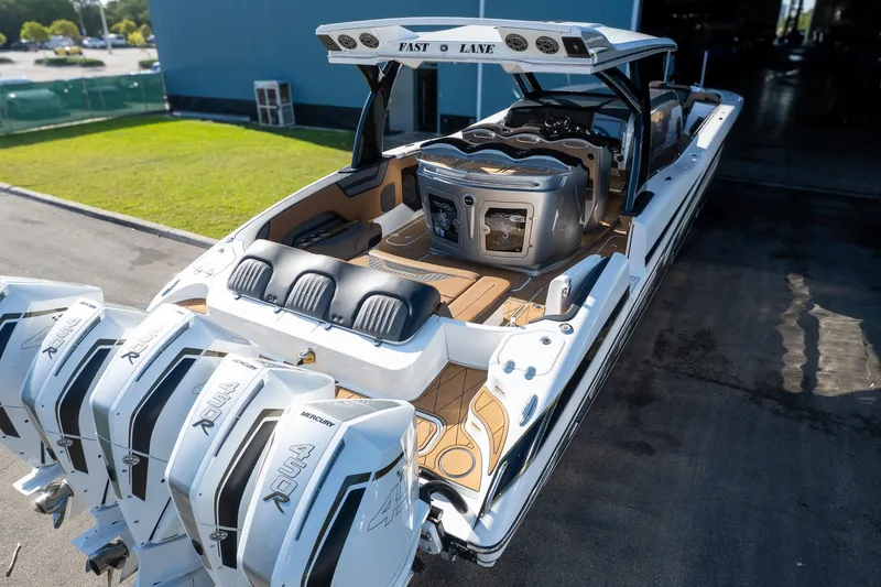  Yacht Photos Pics 2022 MTI V50 boat with multiple engines, sleek design, and luxurious seating.