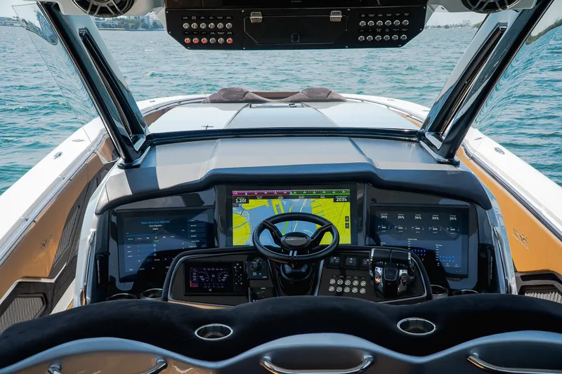  Yacht Photos Pics Cockpit of 2022 MTI V50 boat with advanced navigation system and steering wheel.