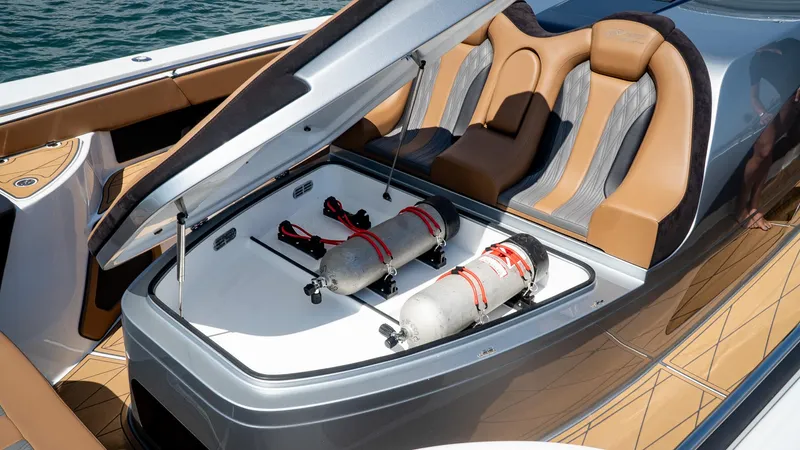  Yacht Photos Pics 2022 MTI V50 boat with open storage compartment and luxury seating.