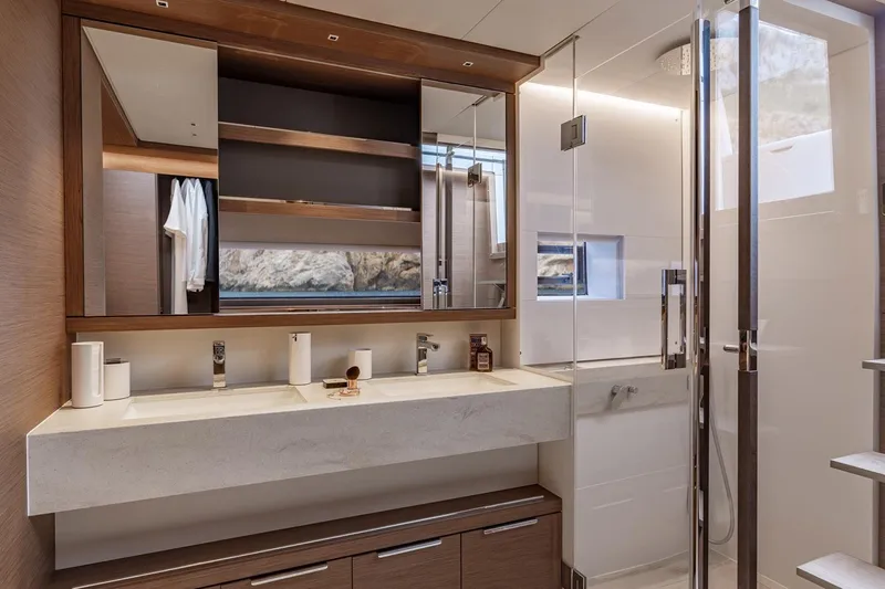  Yacht Photos Pics Manufacturer Provided Image: Luxurious bathroom interior of 2026 Lagoon SIXTY 7 yacht with modern fixtures and elegant design.
