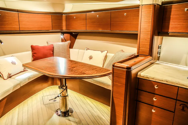 Gazelle Yacht Photos Pics Luxurious interior of 2014 Zeelander Z44 yacht with elegant wood finish and cozy seating area.