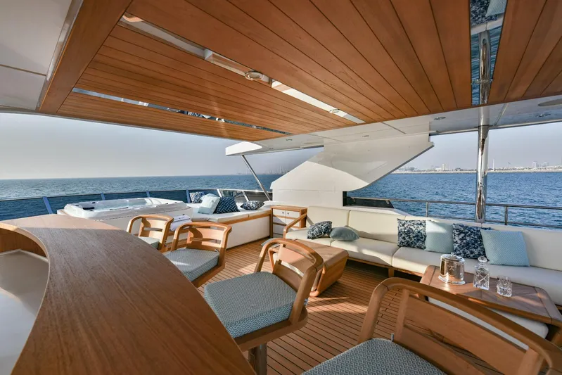  Yacht Photos Pics Luxurious 2025 Majesty 120 yacht deck with elegant seating and ocean view.
