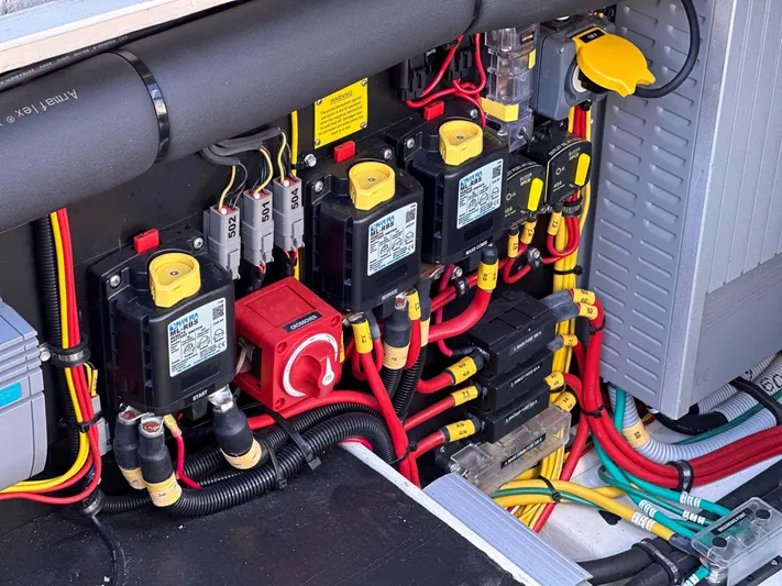  Yacht Photos Pics Electrical system of a 2019 Targa 32 boat, featuring circuit breakers and wiring.