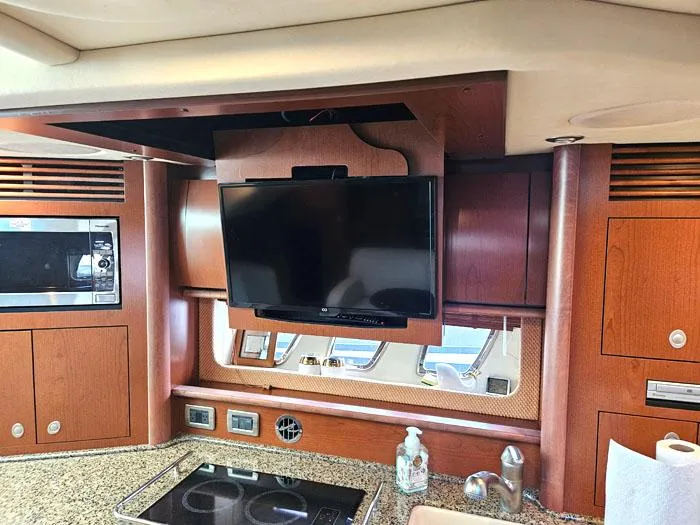  Yacht Photos Pics Interior of 2007 Sea Ray 40 Sundancer with TV, microwave, and kitchen amenities.