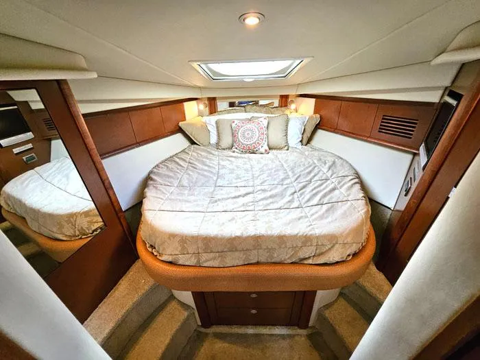  Yacht Photos Pics Luxurious cabin interior of 2007 Sea Ray 40 Sundancer yacht with cozy bedding.