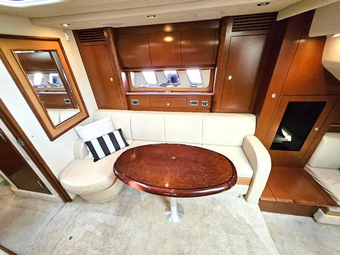  Yacht Photos Pics Luxurious 2007 Sea Ray 40 Sundancer interior with elegant wood and cream upholstery.