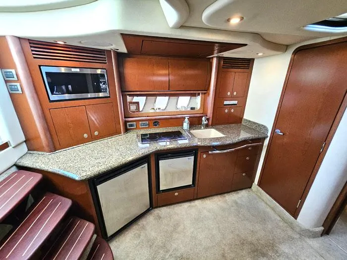  Yacht Photos Pics Luxurious 2007 Sea Ray 40 Sundancer yacht interior with modern kitchen amenities.