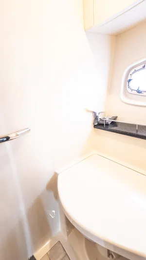 Jones'n Yacht Photos Pics Bathroom interior of 2009 Sea Ray 470 Sundancer yacht, featuring a sleek sink and window.