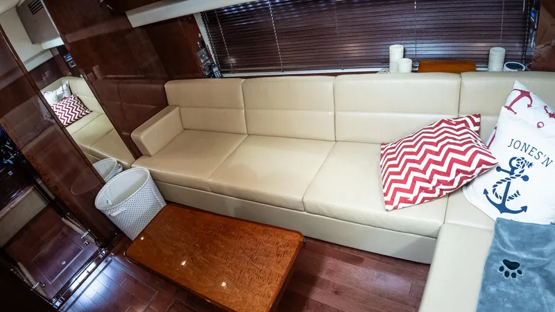 Jones'n Yacht Photos Pics Luxurious interior of 2009 Sea Ray 470 Sundancer with beige sofa and decorative pillows.