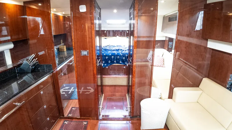 Jones'n Yacht Photos Pics Luxurious interior of 2009 Sea Ray 470 Sundancer yacht with wood finishes and modern amenities.