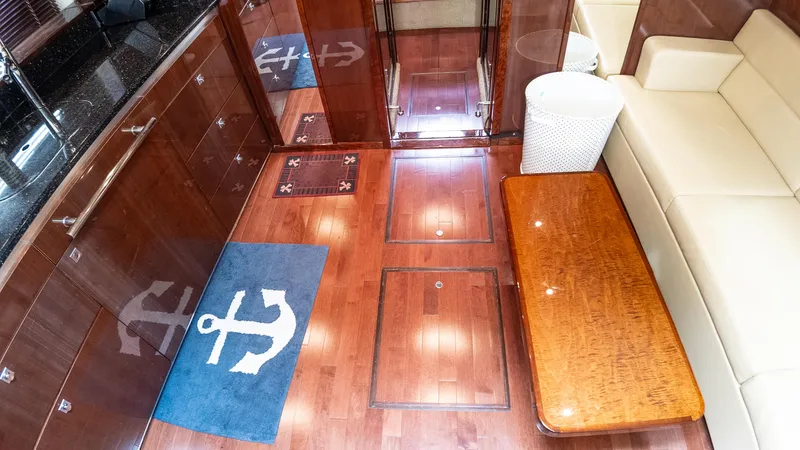 Jones'n Yacht Photos Pics Luxurious interior of 2009 Sea Ray 470 Sundancer yacht with wooden flooring and anchor-themed decor.