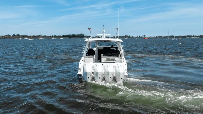  Yacht Photos Pics 2020 Boston Whaler 38 Realm boat cruising on a sunny day.