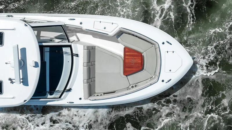  Yacht Photos Pics Top view of 2020 Boston Whaler 38 Realm boat navigating through waves.