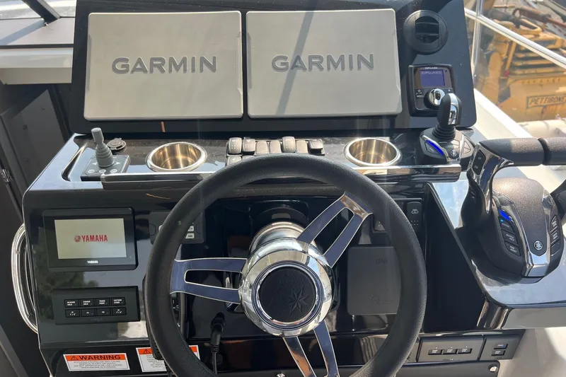  Yacht Photos Pics 2024 Jeanneau NC 1295 Fly helm with Garmin displays and Yamaha controls.