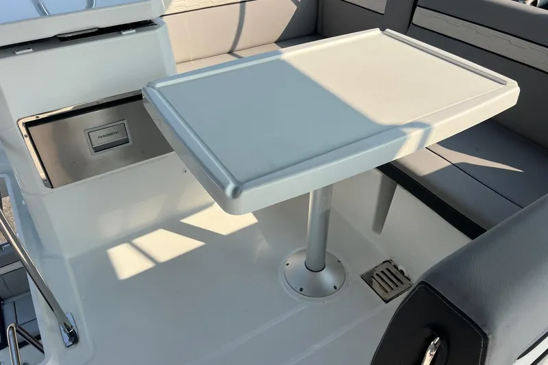  Yacht Photos Pics 2024 Jeanneau NC 1295 Fly interior with table and seating area.