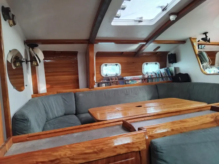 Atanahoue Yacht Photos Pics Cozy interior of 2000 Custom Paladin 60 yacht with wooden accents and seating area.