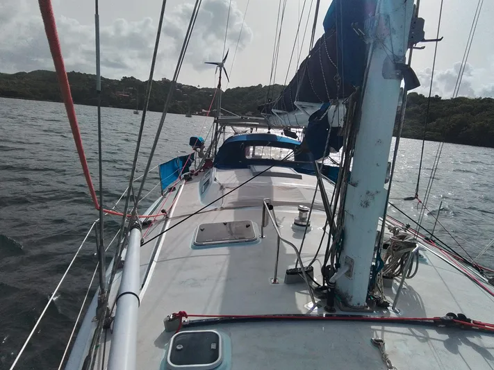 Atanahoue Yacht Photos Pics Sailboat "Paladin 60" on water, custom model from 2000, with visible deck and rigging.