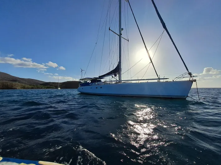 Atanahoue Yacht Photos Pics Sailing yacht "Paladin 60" on calm sea at sunset, 2000 model.