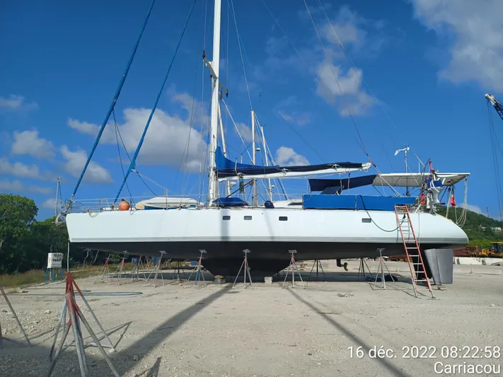 Atanahoue Yacht Photos Pics Sailboat "Custom Paladin 60" on land, Carriacou, December 2022, clear sky background.