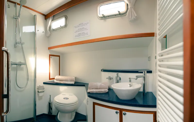  Yacht Photos Pics Luxurious bathroom in 2011 Privateer Trawler 50 yacht with modern fixtures and elegant design.