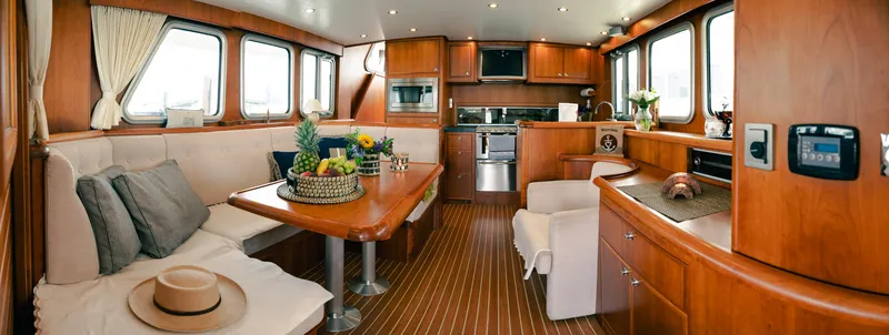  Yacht Photos Pics Luxurious interior of 2011 Privateer Trawler 50 with elegant wood finishes and modern amenities.