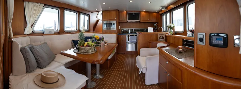  Yacht Photos Pics Luxurious interior of 2011 Privateer Trawler 50 yacht with elegant wood finishes and modern amenities.