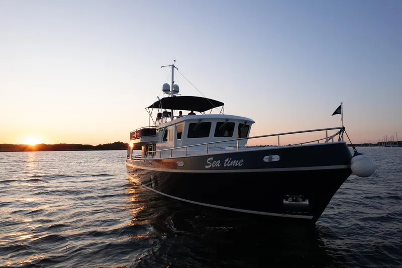 Yacht Photos Pics Privateer Trawler 50 yacht at sunset, 2011 model, on calm waters.