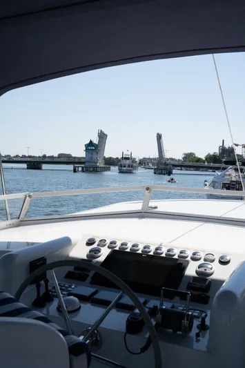 Yacht Photos Pics View from 2011 Privateer Trawler 50 helm, approaching open drawbridge on a sunny day.