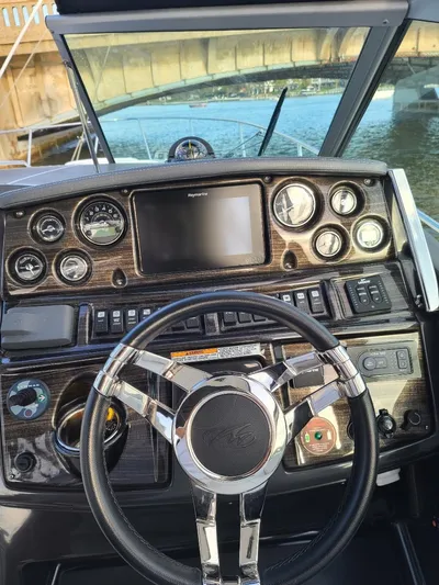  Yacht Photos Pics 2018 Monterey 295 Sport Yacht dashboard with steering wheel and control panel.