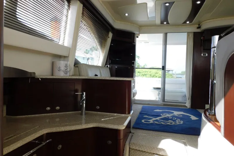 Full Deck Yacht Photos Pics Luxurious interior of 2008 Sea Ray 44 Sedan Bridge yacht with modern design and amenities.