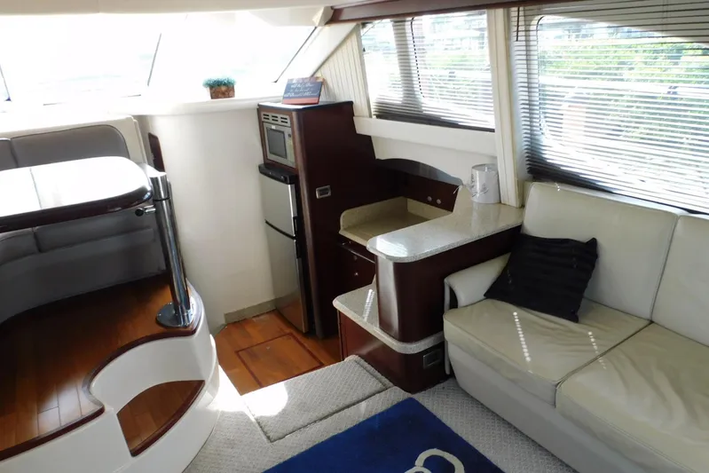 Full Deck Yacht Photos Pics Interior of 2008 Sea Ray 44 Sedan Bridge yacht with modern seating and kitchenette.