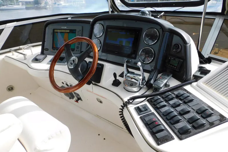 Full Deck Yacht Photos Pics 2008 Sea Ray 44 Sedan Bridge helm with navigation screens and controls.