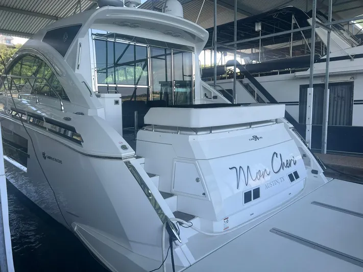 Mon Cheri Yacht Photos Pics 2018 Cruisers Yachts 54 Cantius docked in a covered marina.