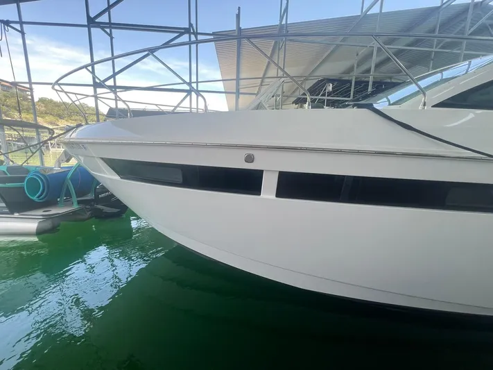 Mon Cheri Yacht Photos Pics 2018 Cruisers Yachts 54 Cantius docked, showcasing sleek design and modern architecture.