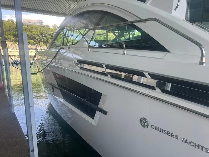 Mon Cheri Yacht Photos Pics 2018 Cruisers Yachts 54 Cantius docked under a covered marina.